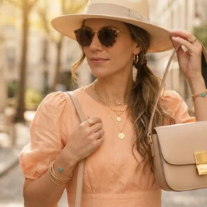 Peach dress with nude accessories dress color combination for female party wear